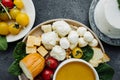 Delicious cheese plate with different types of cheeses: mozzarella, Georgian, cottage cheese, smoked, parmesan, spicy, hard Royalty Free Stock Photo