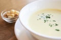 Delicious cheese soup. White dishes. Small crackers Royalty Free Stock Photo