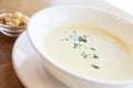 Delicious cheese soup. White dishes. Small crackers Royalty Free Stock Photo