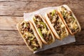 Delicious cheesesteak sandwiches close-up on the table. Horizontal top view