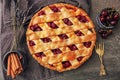 Delicious cherry pie on table, top view