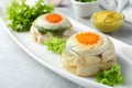 Delicious chicken aspic served on light grey table, closeup Royalty Free Stock Photo