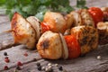 Delicious chicken barbecue on wooden skewers with vegetables