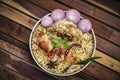 Delicious chicken biryani top view.Biryani rice dish Beautiful Indian rice dish.Delicious spicy chicken biryani in bowl over moody Royalty Free Stock Photo