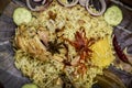 Delicious chicken biryani top view.Biryani rice dish Beautiful Indian rice dish.Delicious spicy chicken biryani in bowl over moody Royalty Free Stock Photo