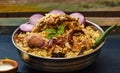 Delicious chicken biryani top view.Biryani rice dish Beautiful Indian rice dish.Delicious spicy chicken biryani in bowl over moody Royalty Free Stock Photo