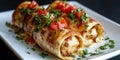Delicious chicken enchiladas with cheese and tomato garnish on white plate Royalty Free Stock Photo