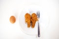 Delicious chicken fried and egg is placed in white dish Royalty Free Stock Photo