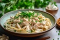 delicious chicken and pasta dish placed on sleek gray background, composition exudes warmth and comfort, with rich tones