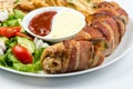 Delicious Chicken rolls with cheese and bacon on a plate close-up. horizontal Royalty Free Stock Photo