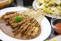 Delicious chicken satay with Lontong on the table