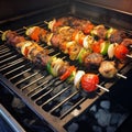 Delicious chicken and vegetable kebabs cooking on grill Royalty Free Stock Photo