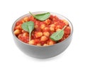 Delicious chickpea curry with basil on white background