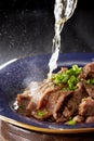 Delicious Chinese cuisine with beef drenched in oil