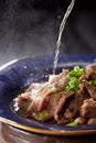 Delicious Chinese cuisine with beef drenched in oil