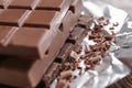 Delicious chocolate bars on foil, closeup Royalty Free Stock Photo