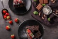 Delicious chocolate cake with berries on grey table Royalty Free Stock Photo