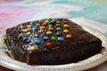 Delicious homemade chocolate cake with colorful candies