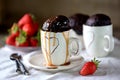 Delicious Chocolate cake cooked in a microwave in a mug with caramel syrup. Royalty Free Stock Photo