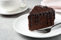 Delicious chocolate cake on light grey table Royalty Free Stock Photo