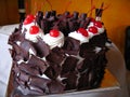 Delicious chocolate cake with maraschino cherries