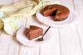 Delicious chocolate cake on plate on table on light background Royalty Free Stock Photo