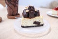 Delicious chocolate cheesecake slice with walnuts on white plate Royalty Free Stock Photo
