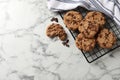 Delicious chocolate chip cookies on white marble table, flat lay. Space for text Royalty Free Stock Photo