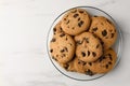 Delicious chocolate chip cookies on white marble table, top view. Space for text Royalty Free Stock Photo