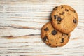 Delicious chocolate chip cookies on wooden table, Royalty Free Stock Photo