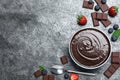 Delicious chocolate cream with berries and mint on grey table, flat lay. Space for text Royalty Free Stock Photo