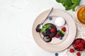 Delicious chocolate fondant served with fresh berries and ice cream on white table, flat lay. Space for text Royalty Free Stock Photo