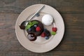 Delicious chocolate fondant served with fresh berries and ice cream on wooden table, top view Royalty Free Stock Photo