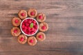 Delicious chocolate lava cakes with fresh raspberries and mint leaf with white bowl of raspberries Royalty Free Stock Photo