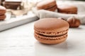 Delicious chocolate macaron on table Royalty Free Stock Photo