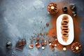 Delicious chocolate mousse with nuts on a dark table with ingredients Royalty Free Stock Photo