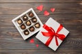 Delicious chocolate pralines in red box for Valentine's Day. Heart shaped box of chocolates top view with copy space Royalty Free Stock Photo