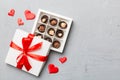 Delicious chocolate pralines in red box for Valentine's Day. Heart shaped box of chocolates top view with copy space Royalty Free Stock Photo