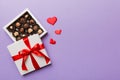 Delicious chocolate pralines in red box for Valentine& x27;s Day. Heart shaped box of chocolates top view with copy space Royalty Free Stock Photo