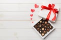 Delicious chocolate pralines in red box for Valentine's Day. Heart shaped box of chocolates top view with copy space Royalty Free Stock Photo