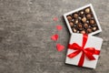 Delicious chocolate pralines in red box for Valentine's Day. Heart shaped box of chocolates top view with copy space Royalty Free Stock Photo