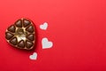 Delicious chocolate pralines in red box for Valentine's Day. Heart shaped box of chocolates top view with copy space Royalty Free Stock Photo