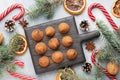 Delicious chocolate truffles sprinkled with cocoa powder on a wooden stand. Christmas tree scenery concept Royalty Free Stock Photo