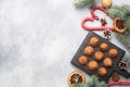 Delicious chocolate truffles sprinkled with cocoa powder on a wooden stand. Christmas tree scenery concept. Copy space Royalty Free Stock Photo