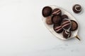 Delicious chocolate truffles on white marble table, flat lay. Space for text Royalty Free Stock Photo