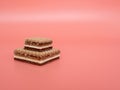 Delicious chocolate wafers with hazelnuts on a pink background. Royalty Free Stock Photo