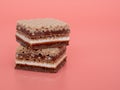 Delicious chocolate wafers with hazelnuts on a pink background. Royalty Free Stock Photo