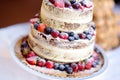 Delicious chocolate wedding cake decorated with fruits and berries Royalty Free Stock Photo