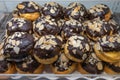 Delicious choux pastry topped with frosted chocolate and almonds