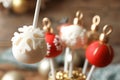 Delicious Christmas ball cake pop on blurred background, closeup Royalty Free Stock Photo